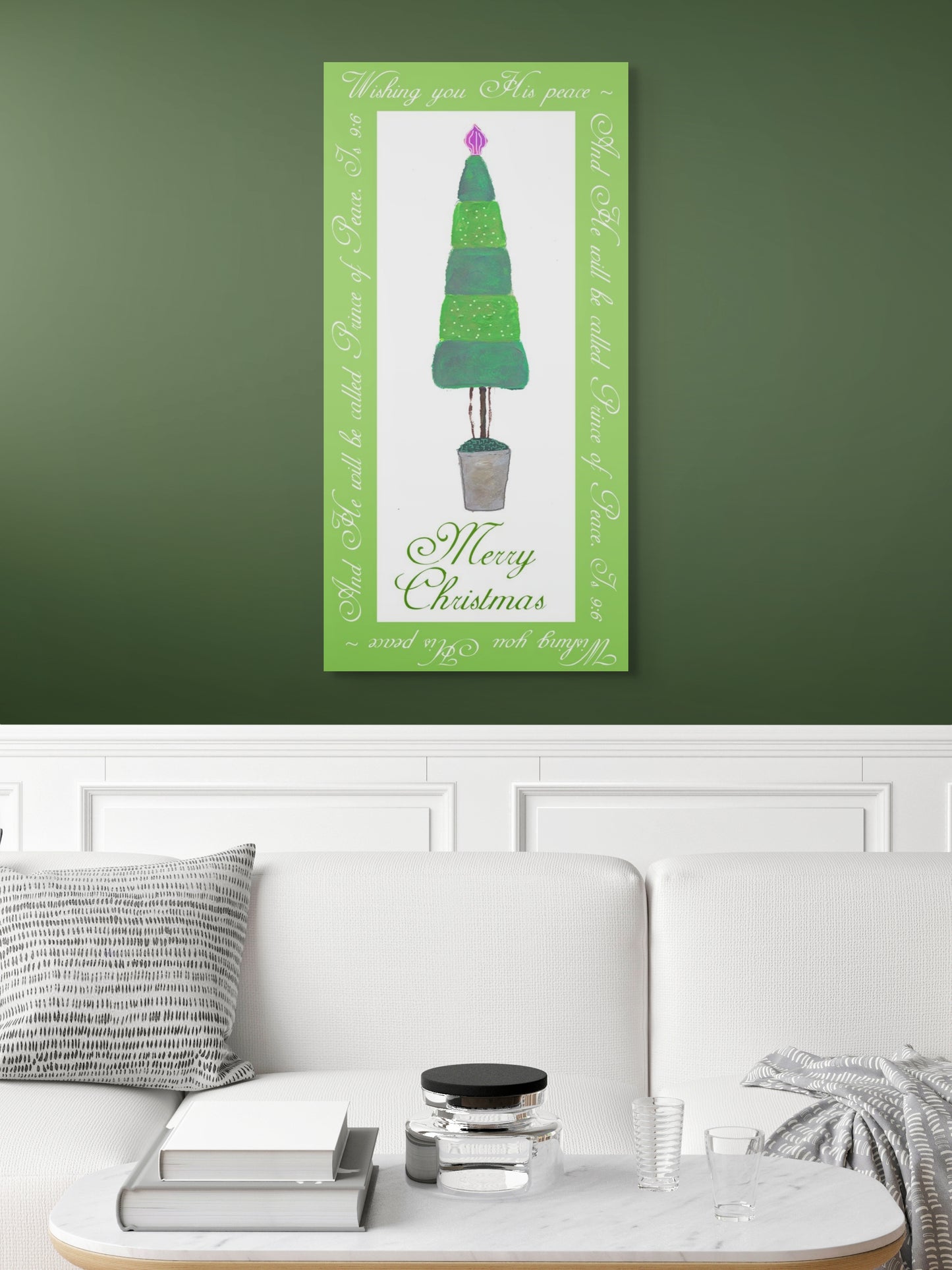Decorative Christmas tree wall art on a green wall above a white sofa.